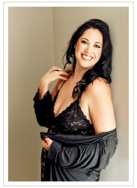dark haired woman with black lace lingerie and black button down shirt