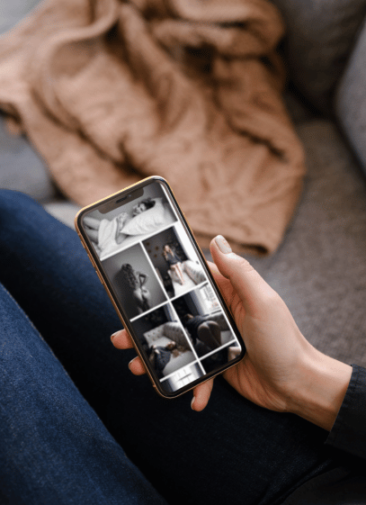 woman looking at her boudoir photos on customized app